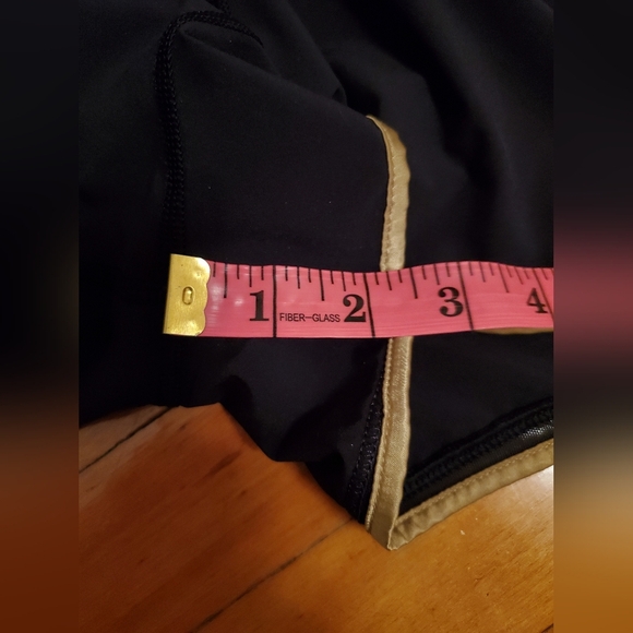 Lululemon Super Squad shorts. Black and gold. Size 6. Built in liner. - Picture 10 of 12